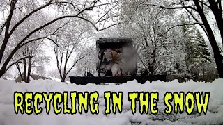 Today's On The Go Adventure watches a recycle truck working its route in the snow.