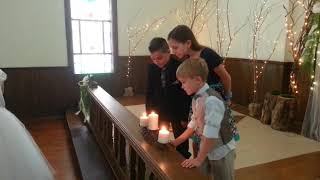 The kids blow out the Unity Candle / Priscilla and Robert