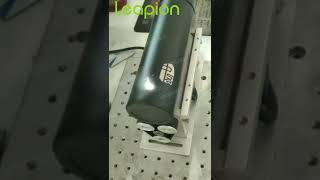 Leapion fiber laser marking machine marking on bottle in rotation