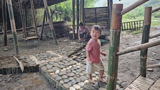 Girl building a path out of stone and dirt - single mother