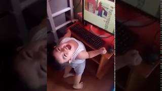 Funny kid reacting to a superhero video