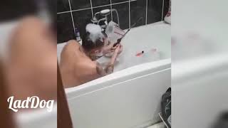 Dad caught in the bath playing with son's toy. | LadDog