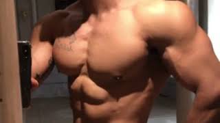 Middle eastern bodybuilder flexing his six abs