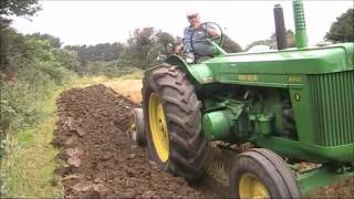 John Deere R ploughing