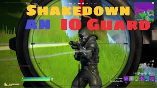 Shakedown an IO Guard &  Legendary Quest shaking down opponents at the same time - Fortnite Week 9