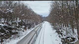 Amtrak Empire Service train through snow in Garrison New York