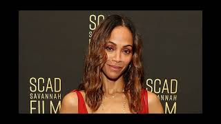 Zoe Saldana goes braless in a plunging red hot dress as she attends the 27th SCAD Savannah Film Fest