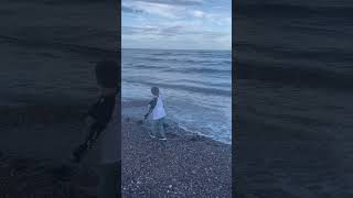 Throwing stones into the sea at Stonehaven