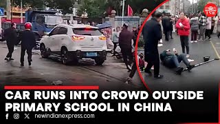 Several injured as car plows into crowd outside primary school in China