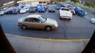 Security camera captures man being punched in face following minor car accident