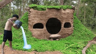 Building Primitive Mud Houses With Grass Growing Around