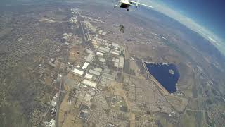 Wingsuit above plane  (skyvan)