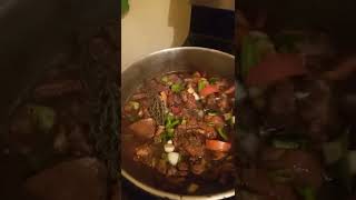 cooking callaloo rice along with stew chicken