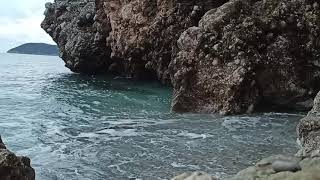 Stony beach, cliffs and pure sea water