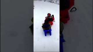 My sons laughing and having so much fun sliding down in the snow