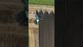 Tractor ploughing and leveling the field #