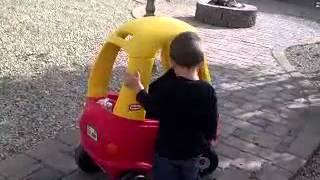 baby gives his dog a ride