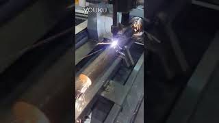 CNC Plasma cutting machine cutting metal tube with rotary