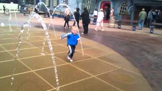 Archie running the through the fountains