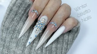 Acrylic stiletto nails with winter theme