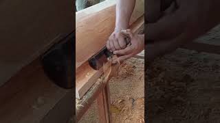 cleaning wood with hand saw.