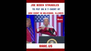 Joe Biden struggles to put on a t-shirt at UAW speech…