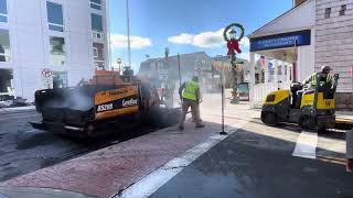 Paving crew patching busy road in downtown New London, CT