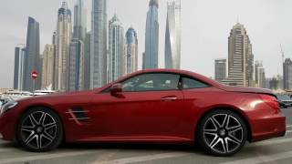 The Mercedes-Benz SL 400's  roof  folds away at the touch of a button