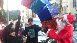 Santa 'Drops' Presents on People Prank