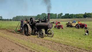 #148 Steam tractor pulling a plow.