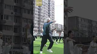 Silver-haired dance professor with vibrant moves