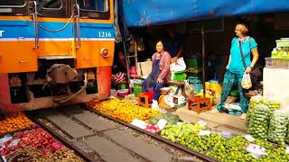 Thailand train passing in the market