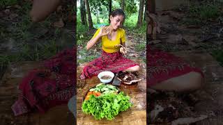 Poor Asian tiny Chef Cooking pork in heavy rain pork cooking