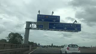 LONG CAR DRIVE ON BRITSH MOTORWAY DURING CLOUDY WEATHER