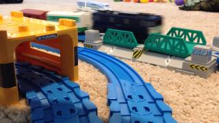 Trains going through tunnel and over drawbridge