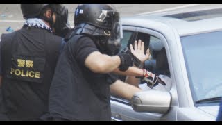 Gun is Pulled on a driver during a protest in Hong Kong