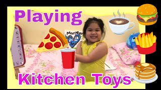 Margeautie pretend playing in restaurant as waitress with kitchen toys