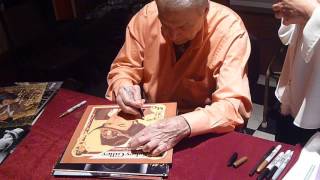 Country star Mickey Gilley graciously signing autographs