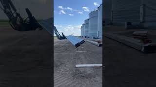 Putting 42’ bin floor panels through bin door #grainhandling #mecalac #8mcr #telehandler  #grainbin