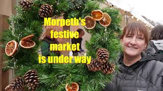 Singing in the rain at Morpeth festive market