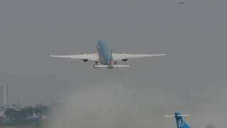 Three aircrafts of VNA landing and taking off Tan Son Nhat airport in rain