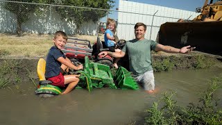 Using tractors to water hay on the farm | Tractors for kids