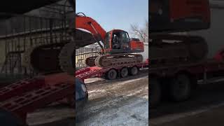 Loading a Doosan Excavator