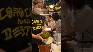 Tokyo drinks. Fresh pineapple Shochu sour at an izakaya in Shibuya.