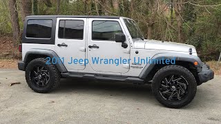 2011 Jeep Wrangler Unlimited sitting on 20”XF Off-Road Wheels wrapped with 245/35-20  Delinte tires.