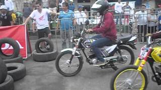 carrera de motos suzuki ax 100 2t en la Troncal Ecuador