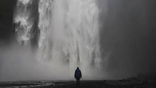 Man Skogafoss Waterfall Iceland   Stock Video Footage