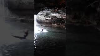 Zipline to a watery landing in a cave!