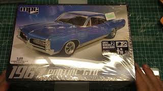 An unboxing on MPC 1967 Pontiac GTO model in white