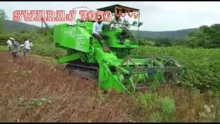 swaraj 7060 track harvester on soyabeen harvesting / mini soyabeen harvester. सोयाबीन काढणी मशीन